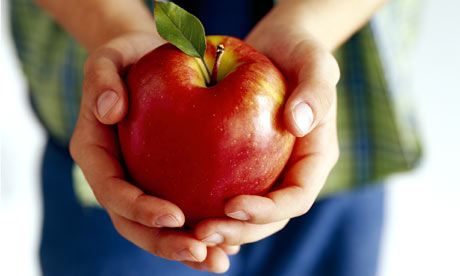 Boy Holding An Apple